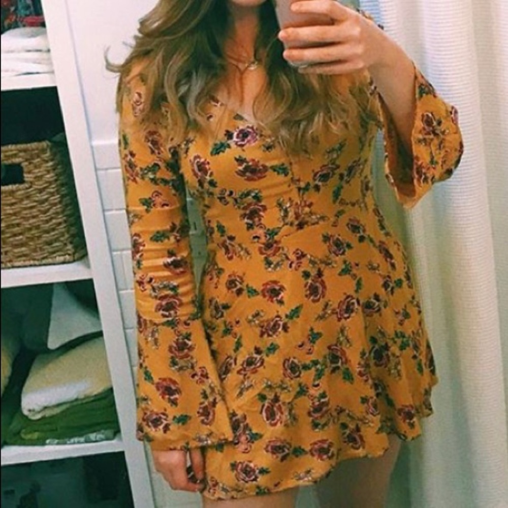 Yellow, floral patrons of peace dress